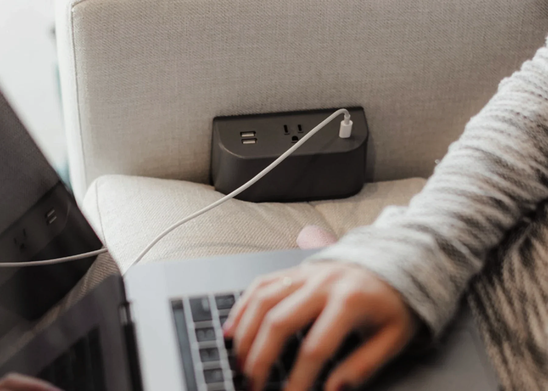 Integrated power and charging at a workplace seat.