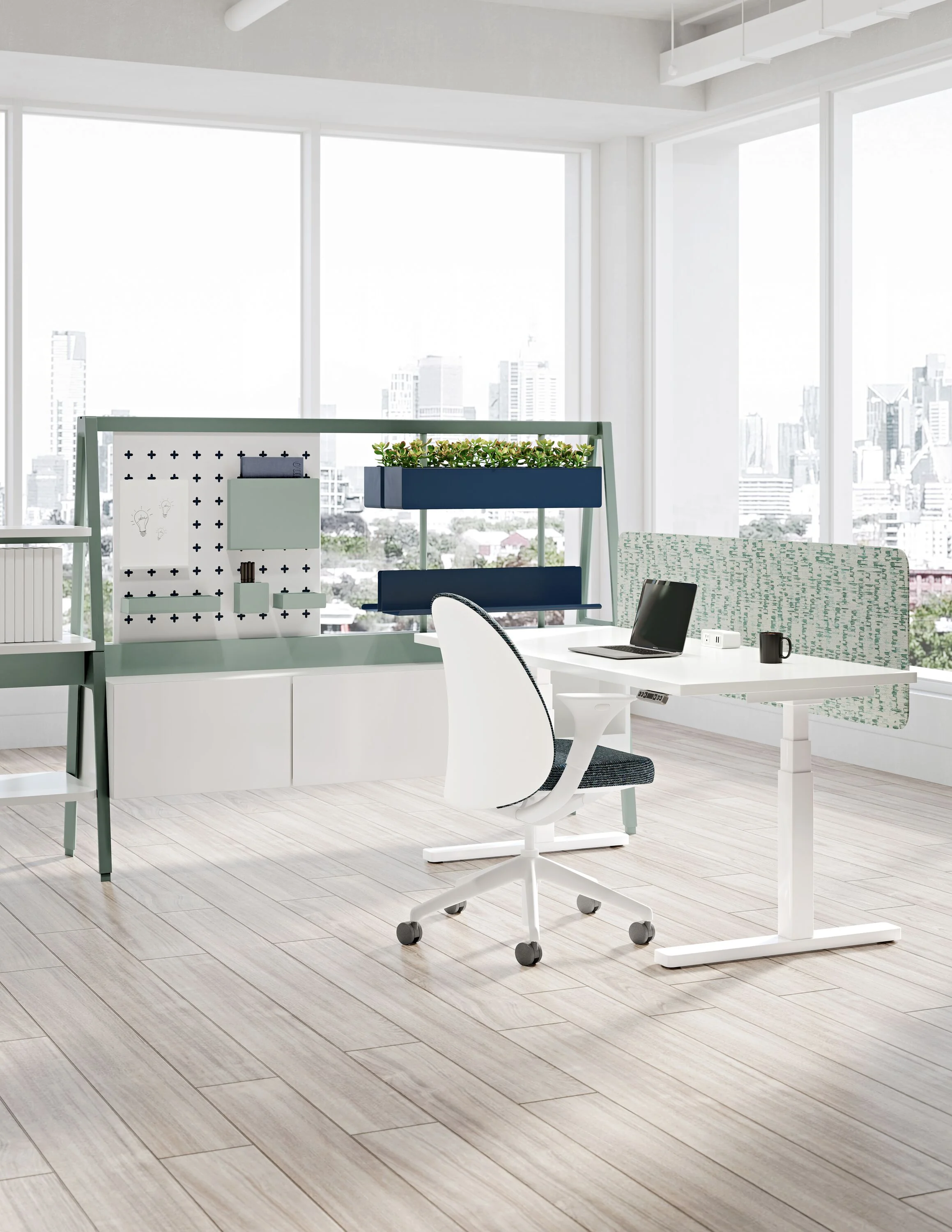 Teknion Expansion Cityline workstation with accessories, screen, and integrated planter.