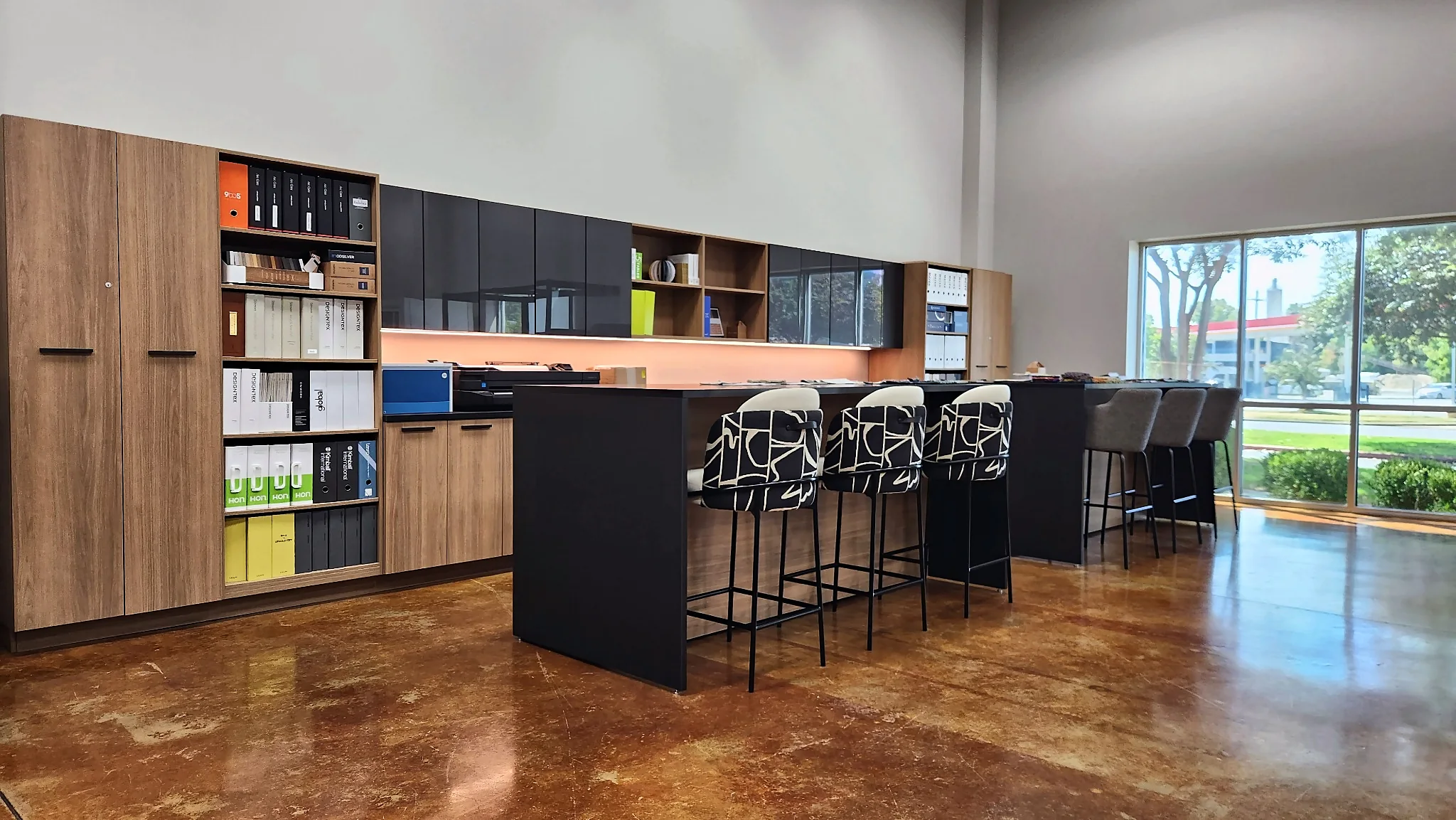 Cabinetry, storage, and a bar-height table in the Pettus Interiors Little Rock showroom
