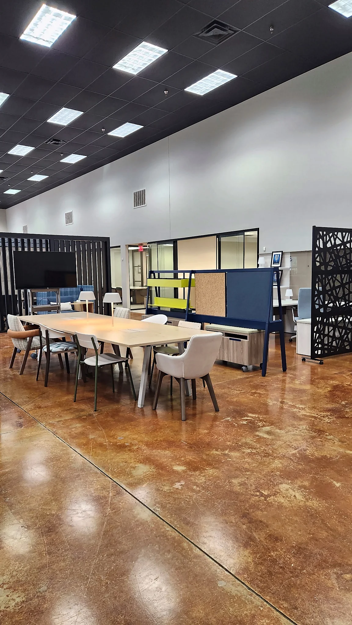 Collaboration tables, seating, and workstations in the Pettus Interiors Little Rock showroom