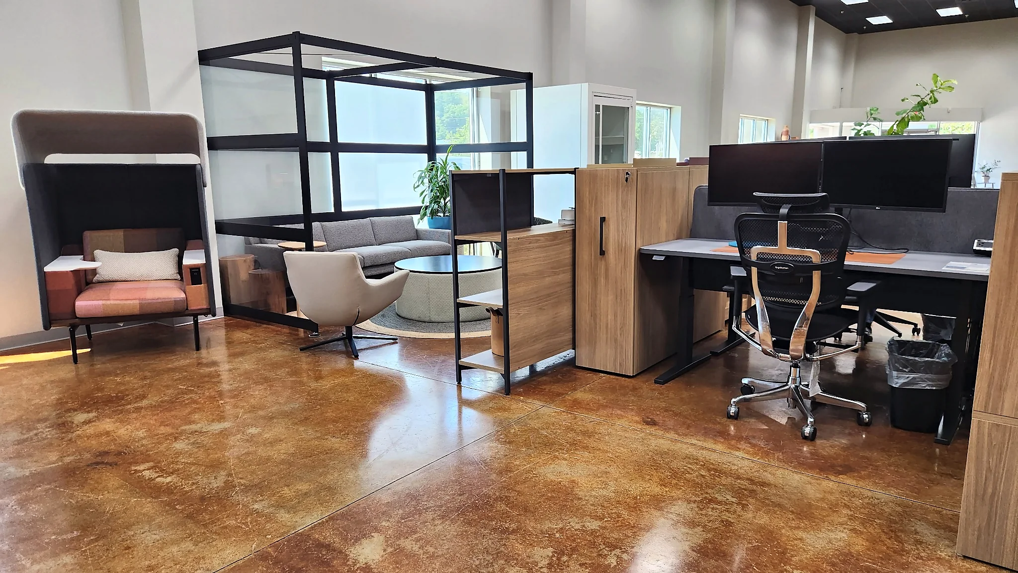 Workstation and lounge furniture arranged in the Pettus Interiors Little Rock showroom