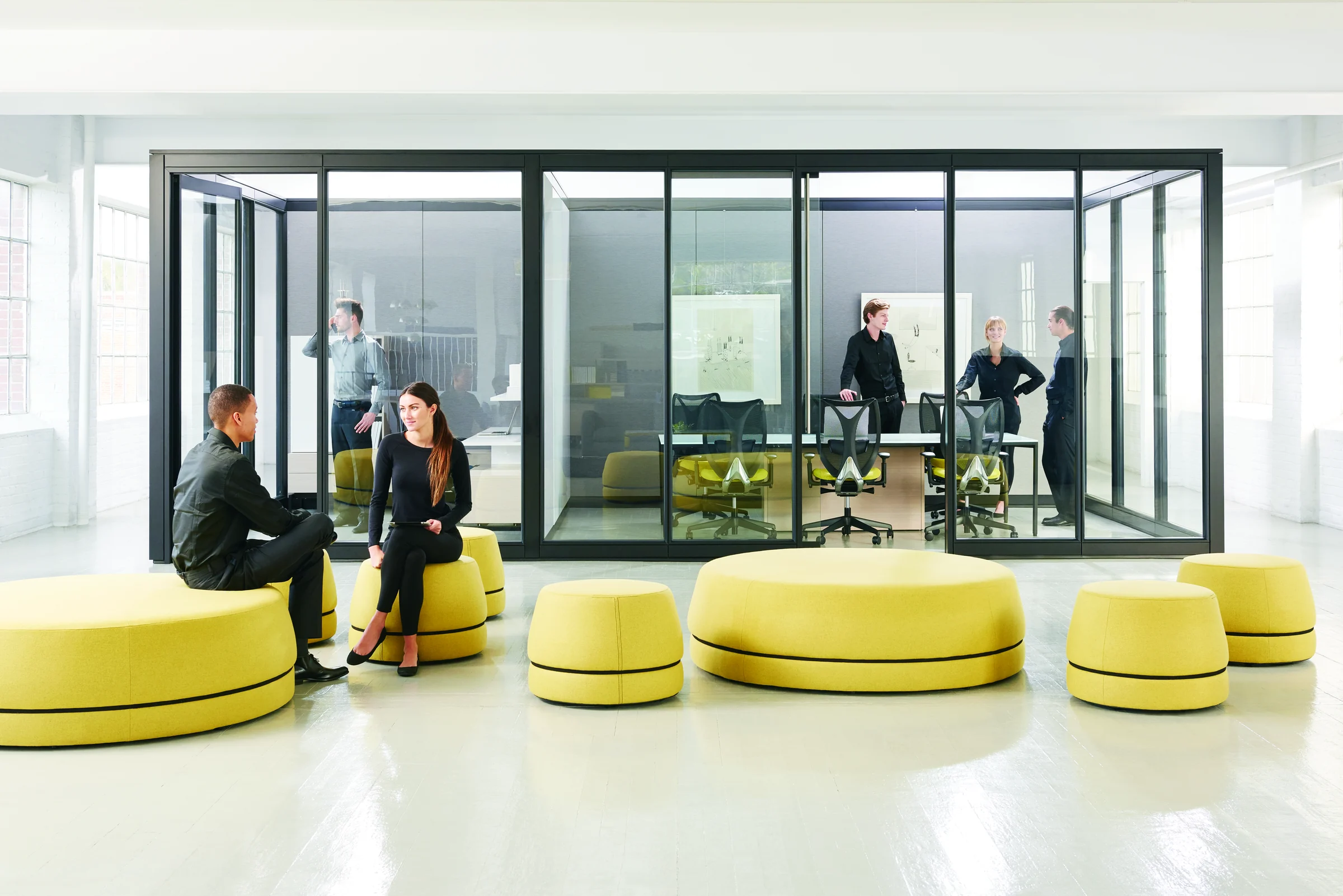 Altos architectural walls forming transparent enclosed offices within an open workplace