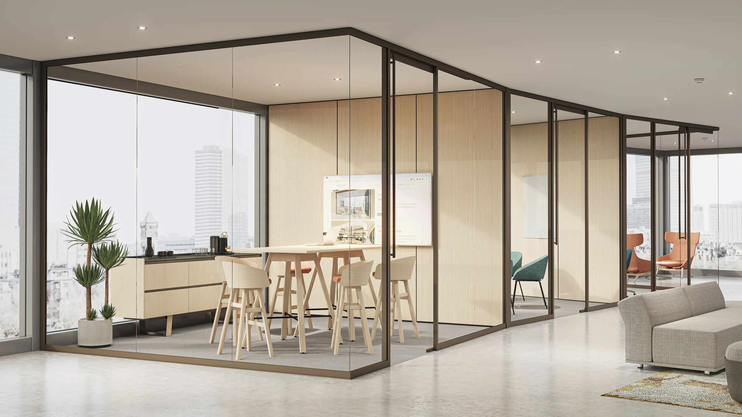 Tek Vue glass office fronts enclosing meeting and collaboration rooms with thin-profile dark frames