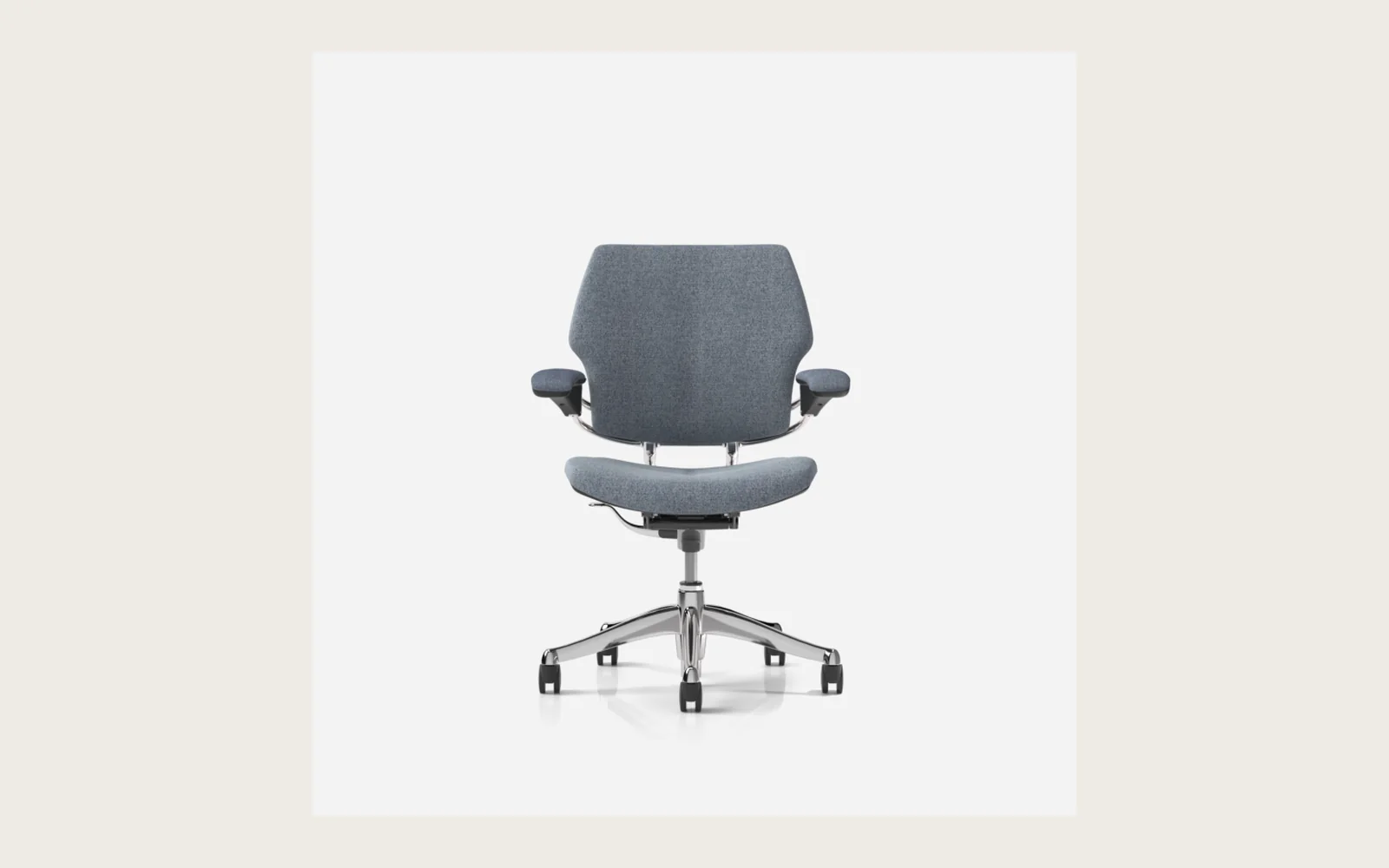 Gray upholstered Humanscale task chair with armrests and a polished five-star base