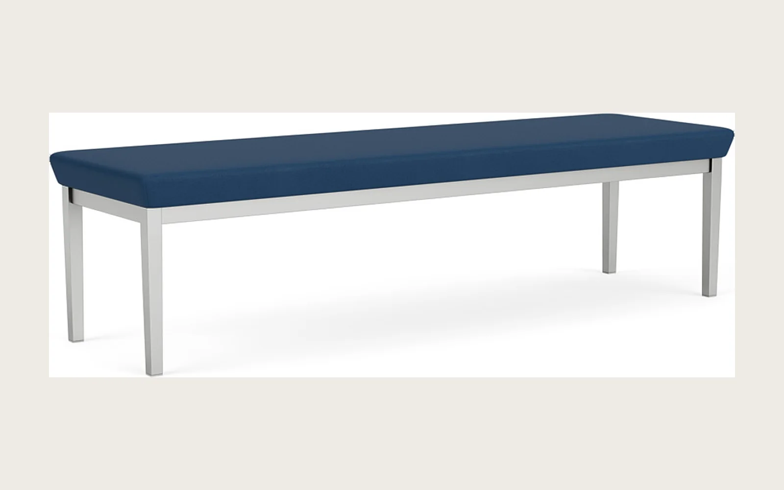 Long blue upholstered Lesro bench with slim silver metal legs on a white background